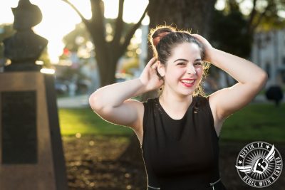 austin high school senior portraits in georgetown texas in town square at dusk