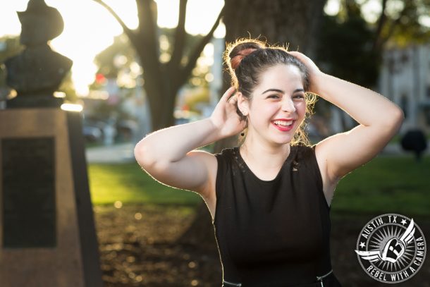 austin high school senior portraits in georgetown texas in town square at dusk