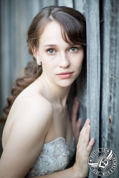 austin bridal portraits of bride leaning against wall in kyle texas