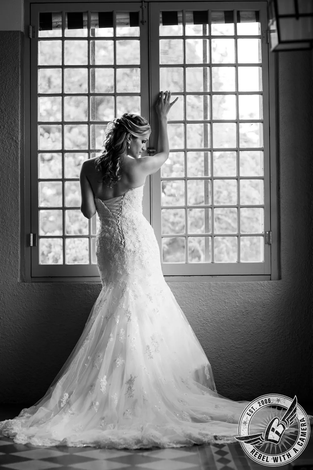 Bride in a white wedding dress photographed in an outdoor portrait setting