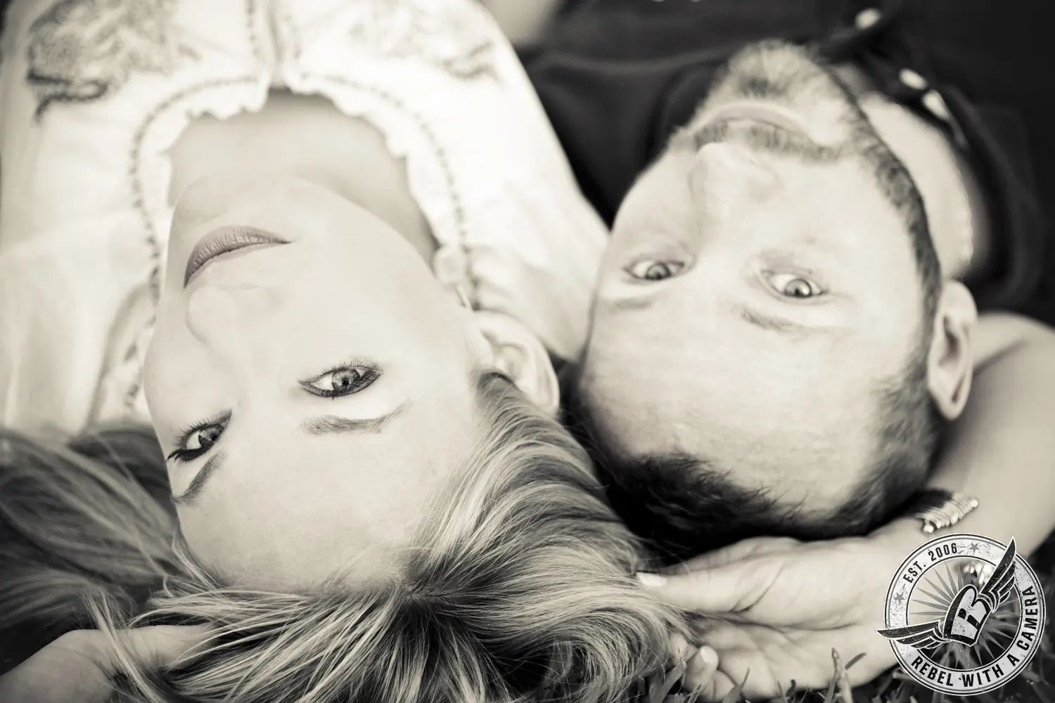 Upside-down black and white portrait of a couple lying together in Austin, TX.
