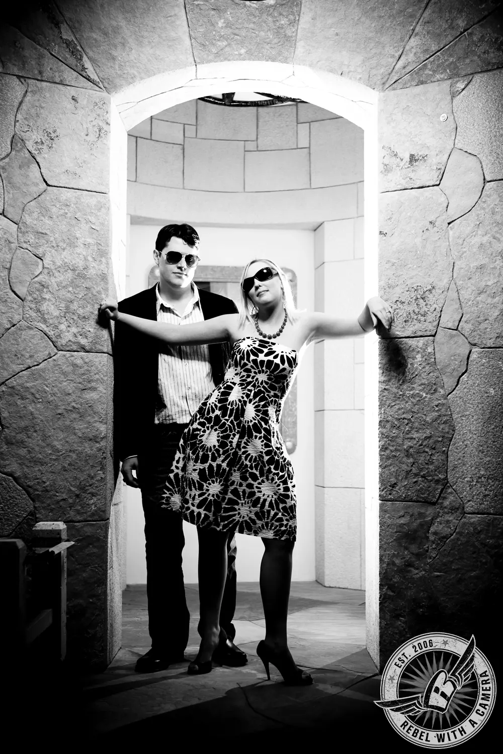 Black and white couple posing in a stone doorway in Austin, TX.