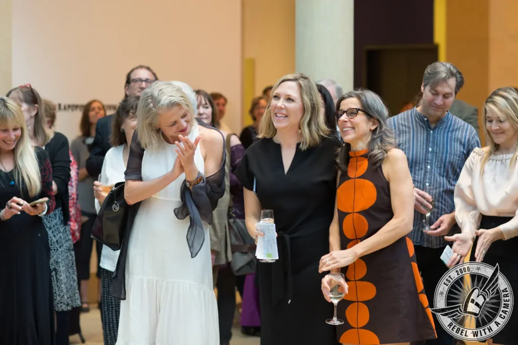 Guests socializing at a museum reception in Austin, TX.