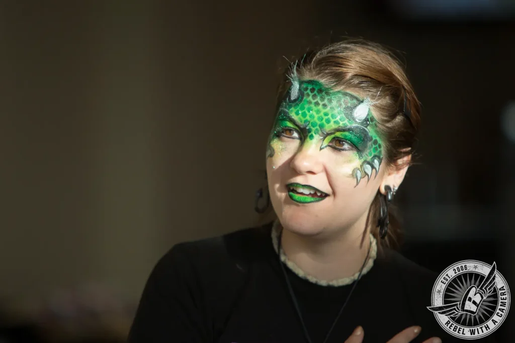 Guest with green dragon face paint at Austin Summerfest in Austin, TX.
