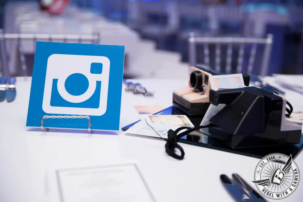 Instagram sign and instant camera at an event media station