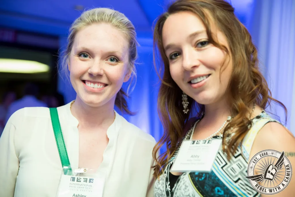 Two smiling women wearing ISES event badges in Austin, TX.