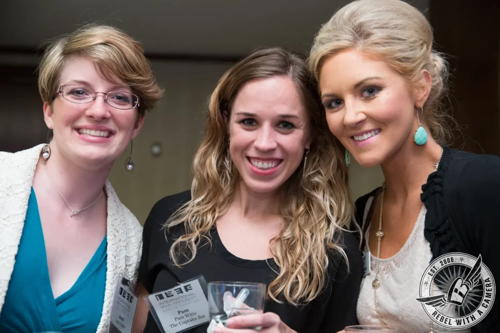 Three smiling women posing together at an ISES event in Austin, TX.