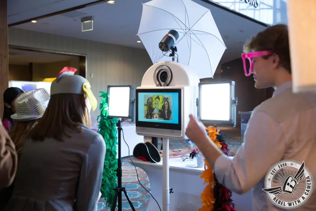 Guests using a photo booth at a corporate event in Austin, TX.