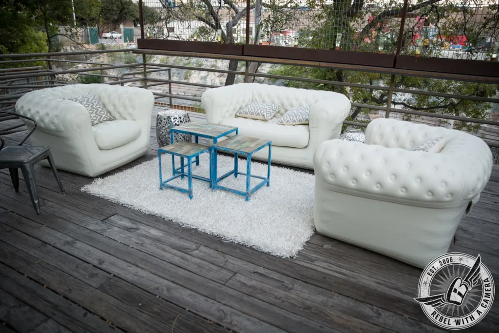 White lounge seating on an outdoor event terrace in Austin, TX.