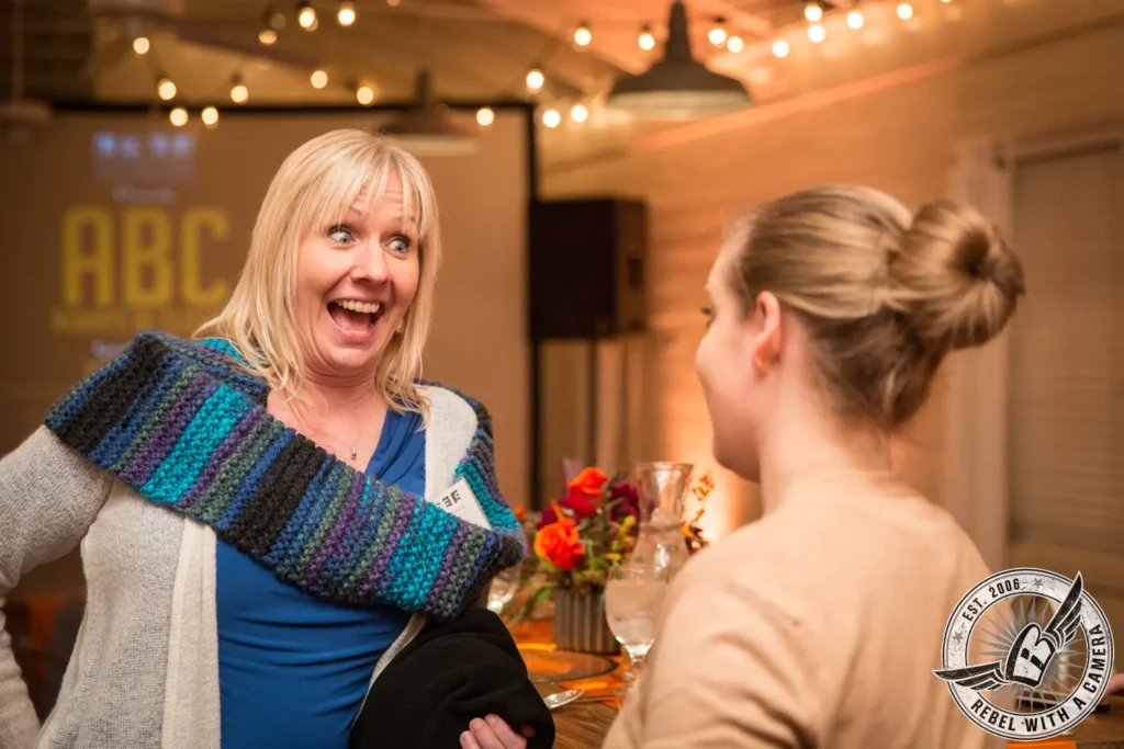 Two women talking at an ISES meeting in Austin, TX.
