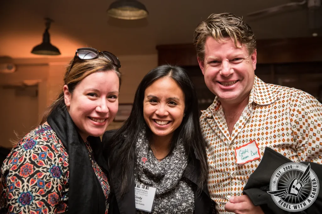 Three smiling attendees posing at an ISES meeting in Austin, TX.