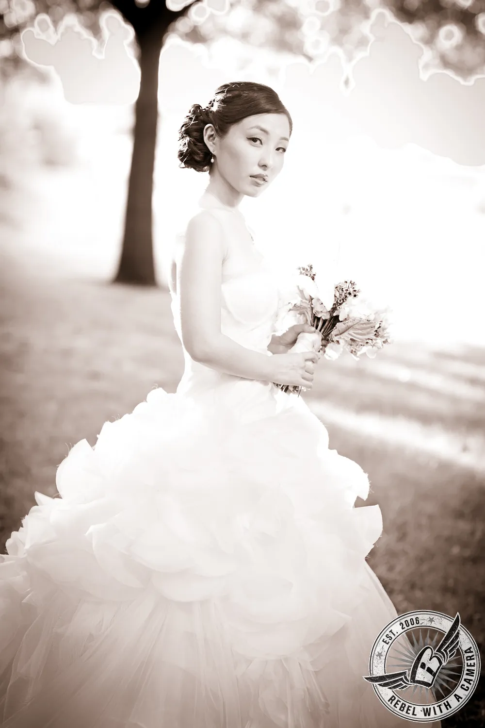 Sepia portrait of a bride holding a bouquet outdoors in Austin, TX.