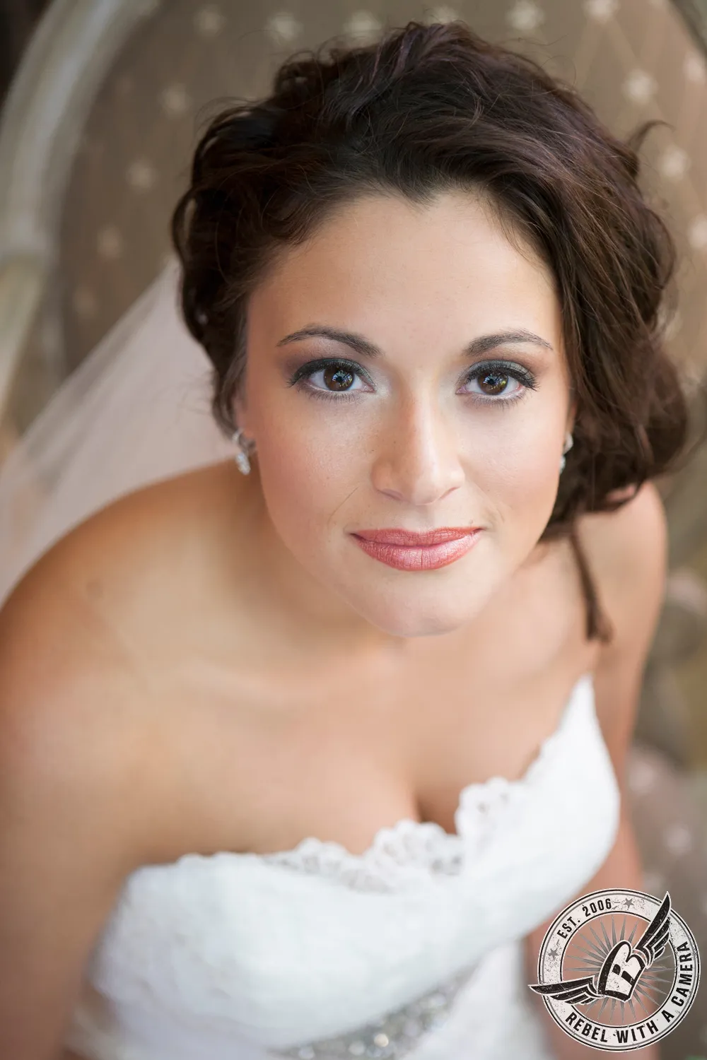 Close portrait of a bride with dark hair and a veil in Austin, TX.
