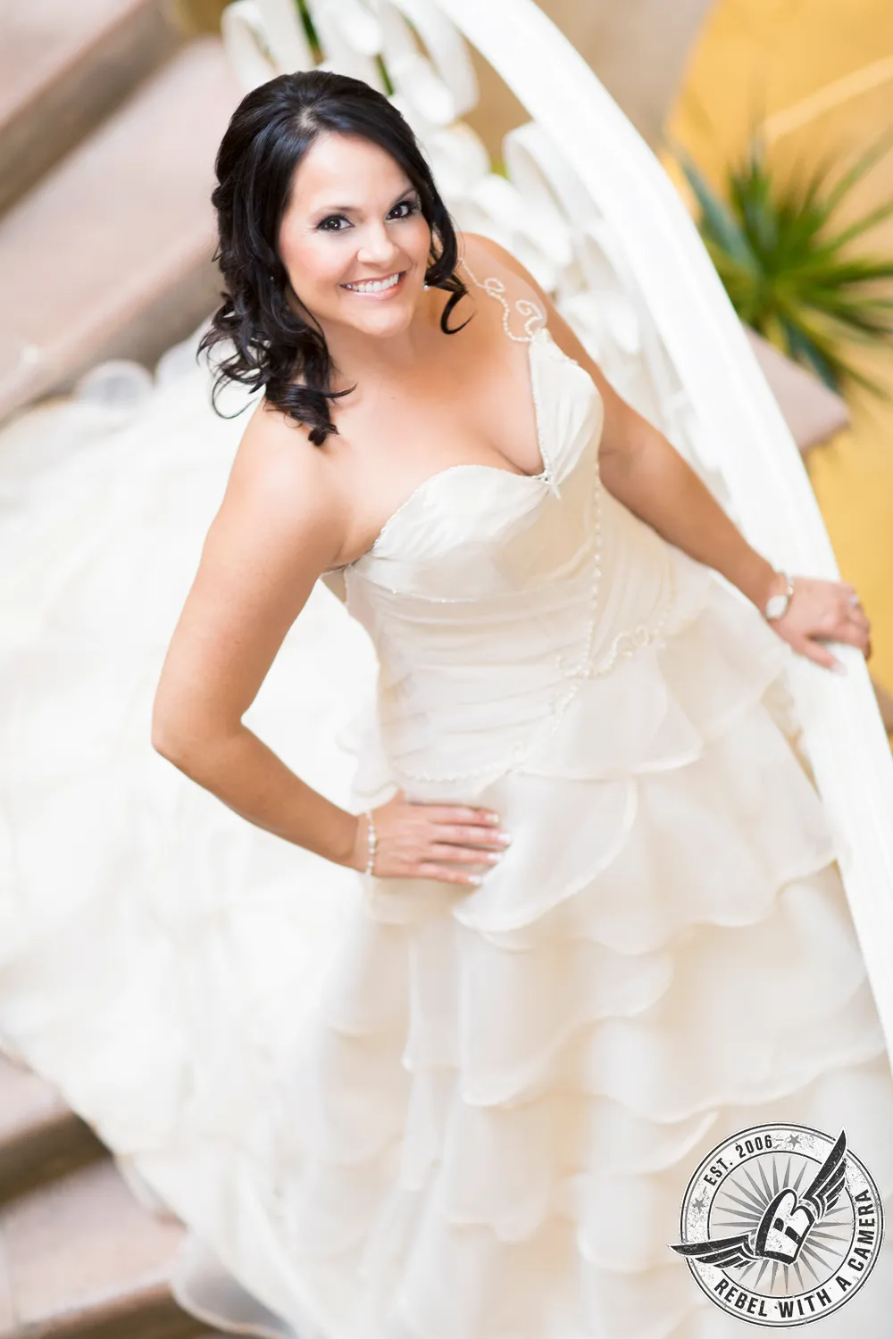 Smiling bride in a layered white wedding dress in Austin, TX.