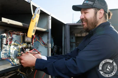 Tri Point Refrigeration Technician Testing HVAC Controls in Austin, TX.